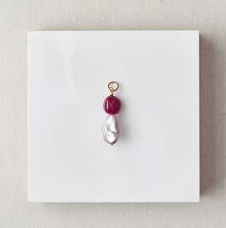 Jewelry pendant on a white card with marble background