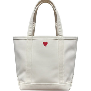 White tote bag with a red heart on a white background
