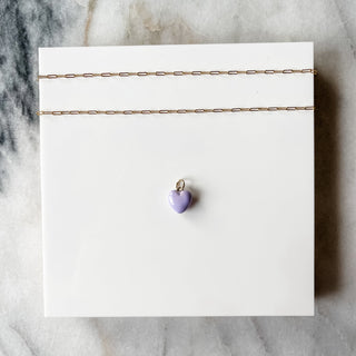 light purple puff heart charm on white background