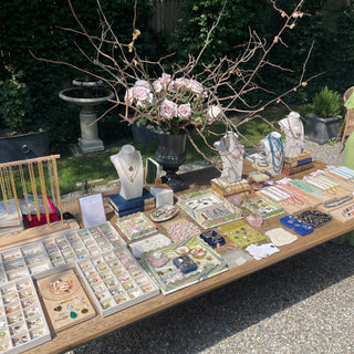 Table with jewelry and decorative items outdoors