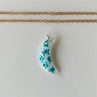 hand painted moon pendant with chain on white background